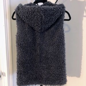Gray vest with a hood and  pockets. Size small.